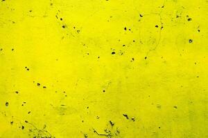 Yellow Paint on Grunge Concrete Wall Background. photo
