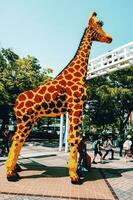 Giraffe sculpture made from lego blocks photo