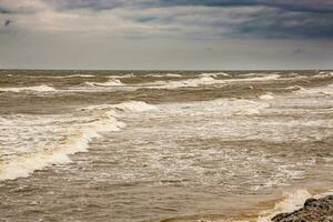 landscape from the beach on the Polish Baltic Sea on a cloudy cool windy spring day photo