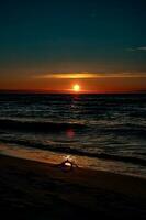 picturesque calm sunset with colorful clouds on the shores of the Baltic Sea in Poland photo