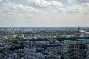 landscape of the city of Warsaw from the vantage point in the Palace of Culture on a warm summer sunny day photo
