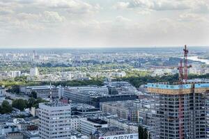 landscape of the city of Warsaw from the vantage point in the Palace of Culture on a warm summer sunny day photo