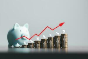 Stacked coins on wooden table with illustration shows increasing of interest rates, financial concept. Interest rate financial and mortgage rates. Icon percentage symbol and arrow pointing up. photo