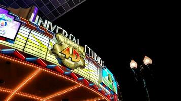 Osaka, Japan in July 2022. Sign of Universal Studio Cinema 4D shining brightly at night at Universal Studios Japan. photo