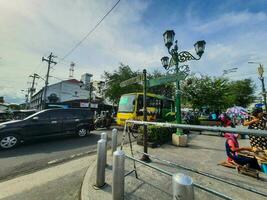 Yogyakarta, Indonesia in July 2022. Trans Jogja bus crossing Malioboro street. photo