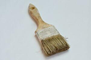 used paint brush isolated at white background photo