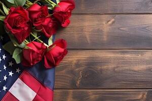 Red roses over the USA flag top view flat lay with copy space. photo