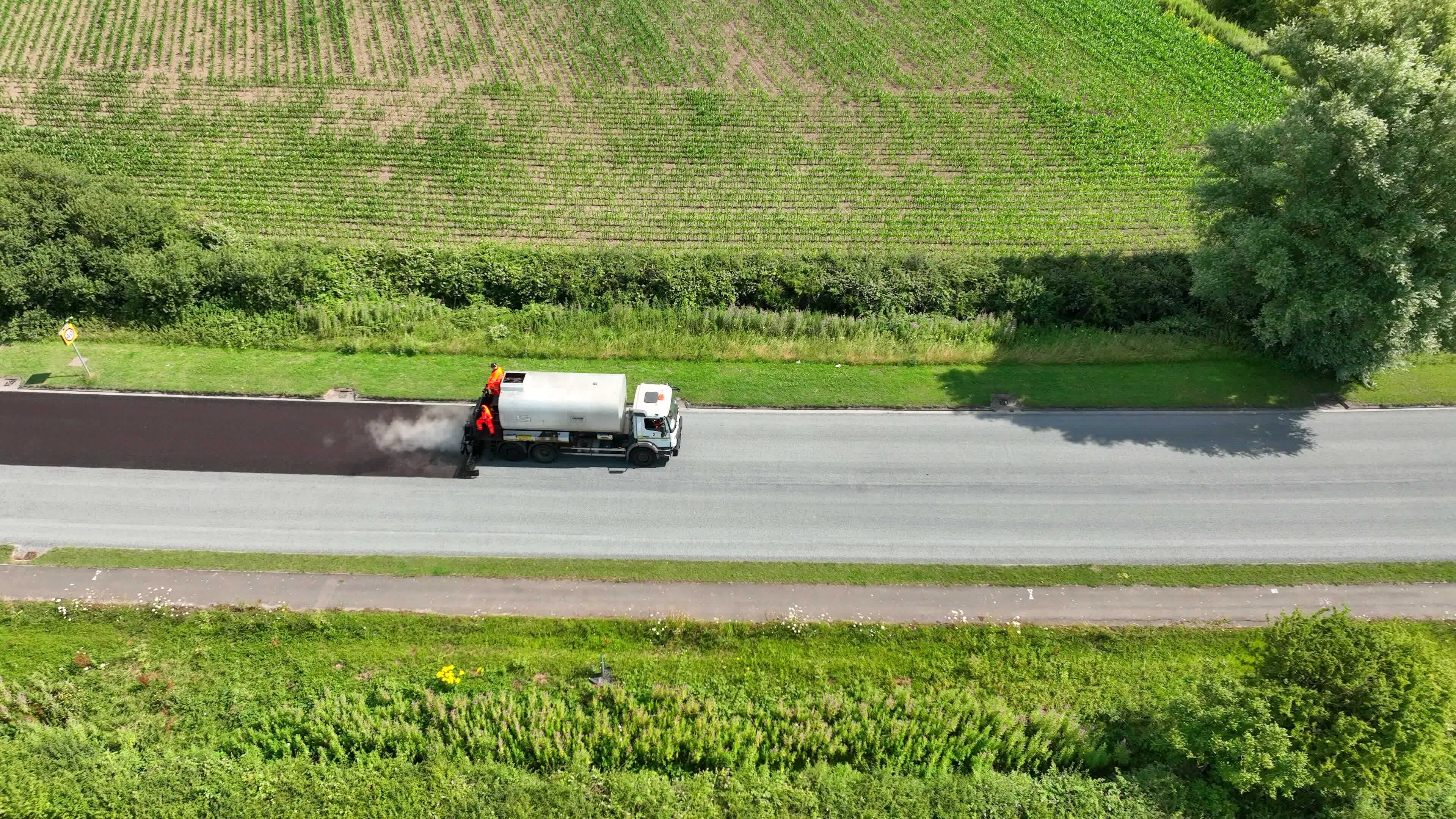 road-resurfacing-aerial-view-of-surface-dressing-micro-asphalt-process