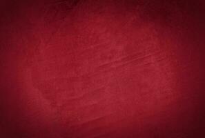 Clásico grunge rojo hormigón textura estudio pared antecedentes con viñeta foto