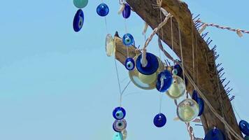 Traditional Turkish Lucky Evil Eye Beads Amulet Hanging on a Dried Tree video