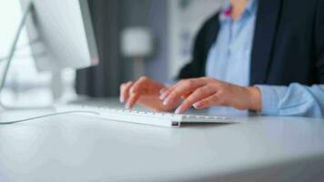 Woman typing on a computer keyboard at home office, monitor with a green screen. Chroma key. Copy Space. Concept of remote work. video