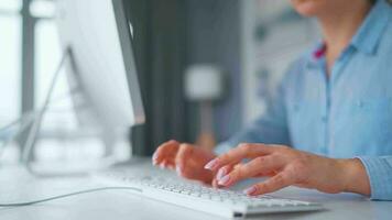 Woman typing on a computer keyboard at home office, monitor with a green screen. Chroma key. Copy Space. Concept of remote work. video