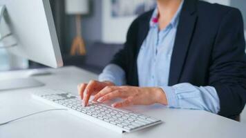 Woman typing on a computer keyboard at home office, monitor with a green screen. Chroma key. Copy Space. Concept of remote work. video