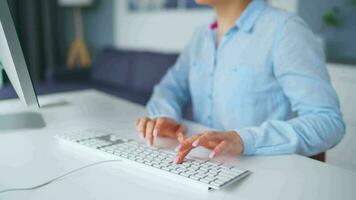 Woman typing on a computer keyboard at home office, monitor with a green screen. Chroma key. Copy Space. Concept of remote work. video