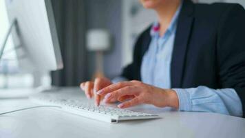 Woman typing on a computer keyboard at home office, monitor with a green screen. Chroma key. Copy Space. Concept of remote work. video