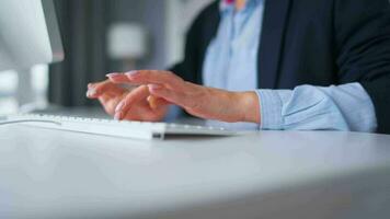 Woman typing on a computer keyboard at home office, monitor with a green screen. Chroma key. Copy Space. Concept of remote work. video