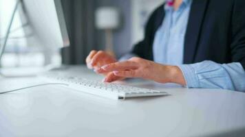 Woman typing on a computer keyboard at home office, monitor with a green screen. Chroma key. Copy Space. Concept of remote work. video