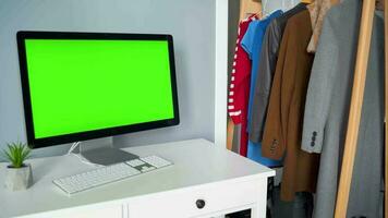 Woman typing on a computer keyboard at home office, monitor with a green screen. Chroma key. Copy Space. Concept of remote work. video