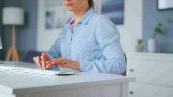 Female hands typing on a computer keyboard. Concept of remote work. Home Office video