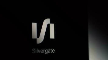 Brands logo of Silvergate Bank on digital monitor. photo