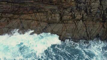 Rugged Cliffs And Ocean Waves In Arteixo, Spain - aerial top down video