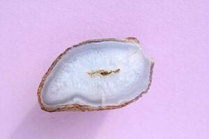 Natural violet amethyst druse geode mineral crystal polished semi-precious gemstone on purple background. Magic rock for witchcraft, spiritual practice, meditation. Esoteric life balance concept photo