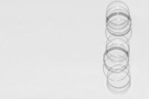 Petri dish. A set of Petri cups. A pipette, glass tube. On a white background. photo