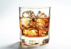 Whiskey with ice in glass on a white background photo
