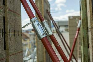 Scaffolding pipe clamp and parts, part of a construction site in Graz, Austria. photo