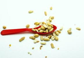 Dry shelled peanuts as background, top view. Healthy snack photo