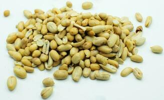 Dry shelled peanuts as background, top view. Healthy snack photo