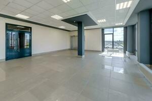 empty modern hall room with columns, doors and panoramic windows. photo