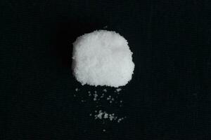 salt powder on a black background. photo