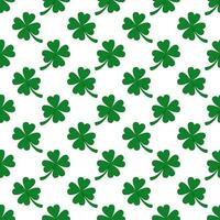 Vector seamless pattern of hand drawn doodle sketch green shamrock clover isolated on white background.