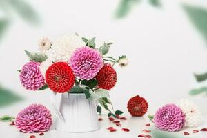 Autumn dahlias flowers bouquet on white table. Wall table background, copy space photo