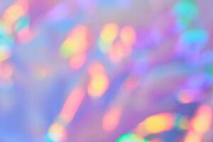 Soft gradient background with Smooth Blurred holographic iridescent colors with golden bokeh. Festive glittering background photo