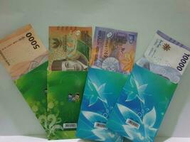 THR envelope containing money to be given to children or family or relations during Eid al-Fitr. photo