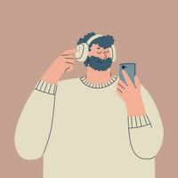 Cute young man in over-ear headphones on his head and with a smartphone in his hand. Bearded guy in a white sweater. Character is listening to music, an audiobook, or a podcast. vector