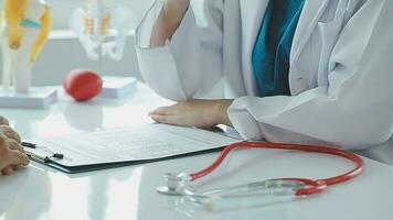 Male patient having consultation with doctor or psychiatrist who working on diagnostic examination on men's health disease or mental illness in medical clinic or hospital mental health service center video