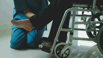 young asian physical therapist working with senior woman on walking with a walker video