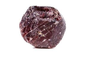 Macro of a mineral garnet stone on a white background photo