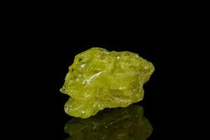 Macro mineral sulfur stone on a black background photo