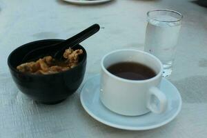 Iftar appetizer of boiled noodles with tea photo