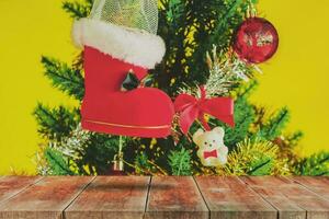 Wood walk and Red Christmas boot with gift on color background. photo