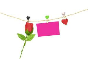 Handmade wood hearts hanging on cloth line and rose flower photo