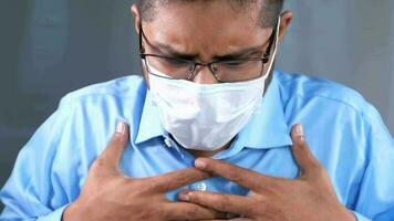 Portrait of sick man sneezes and coughs video