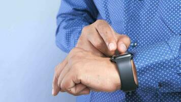 Top view of man's hand using smart watch video