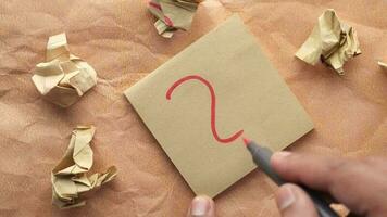 high angle view of question mark on paper on office desk video