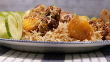 Lamb biryani meal in a bowl on table video