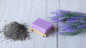 Homemade soap with dried lavender on table with copy space video